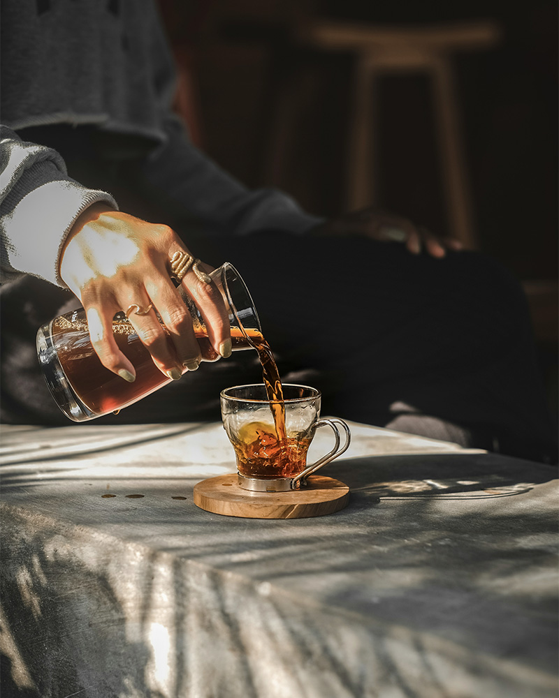 someone pouring a morning cup of coffee