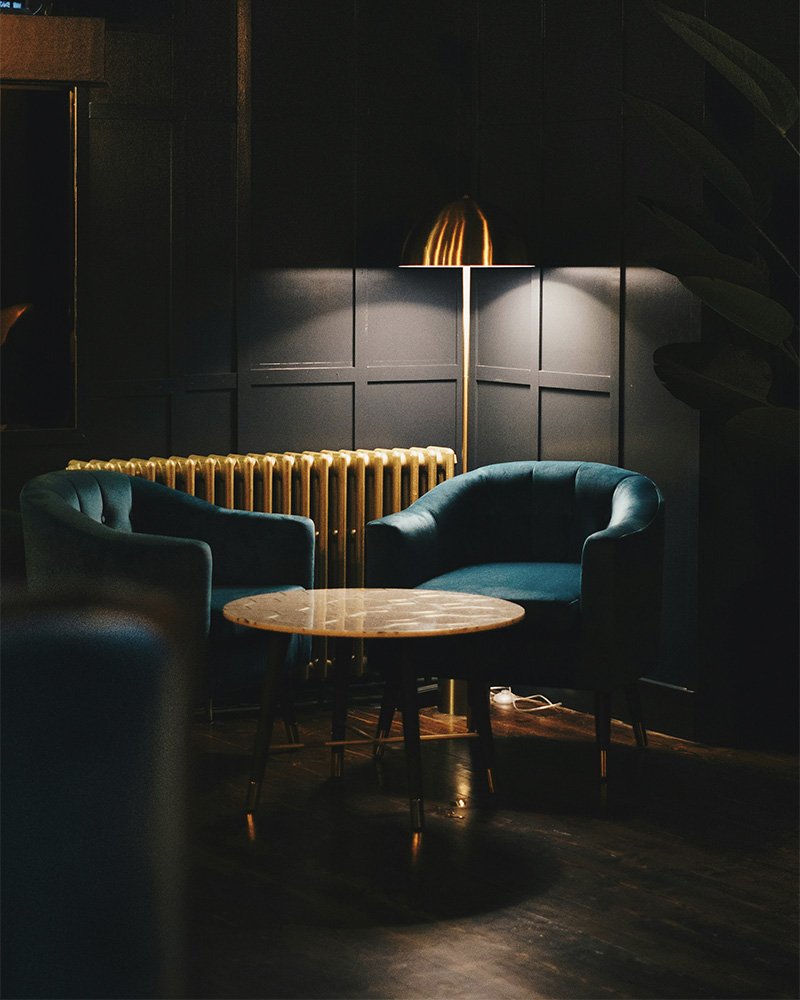 a dimly lit corner of a bar lounge