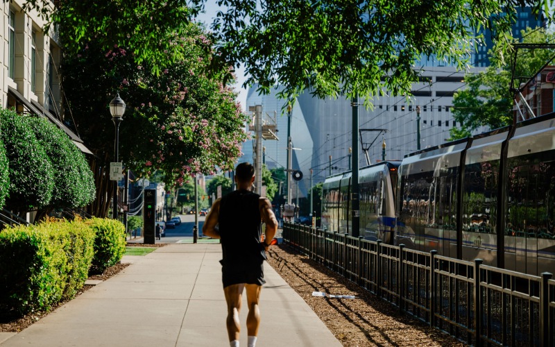 man running by a monorail