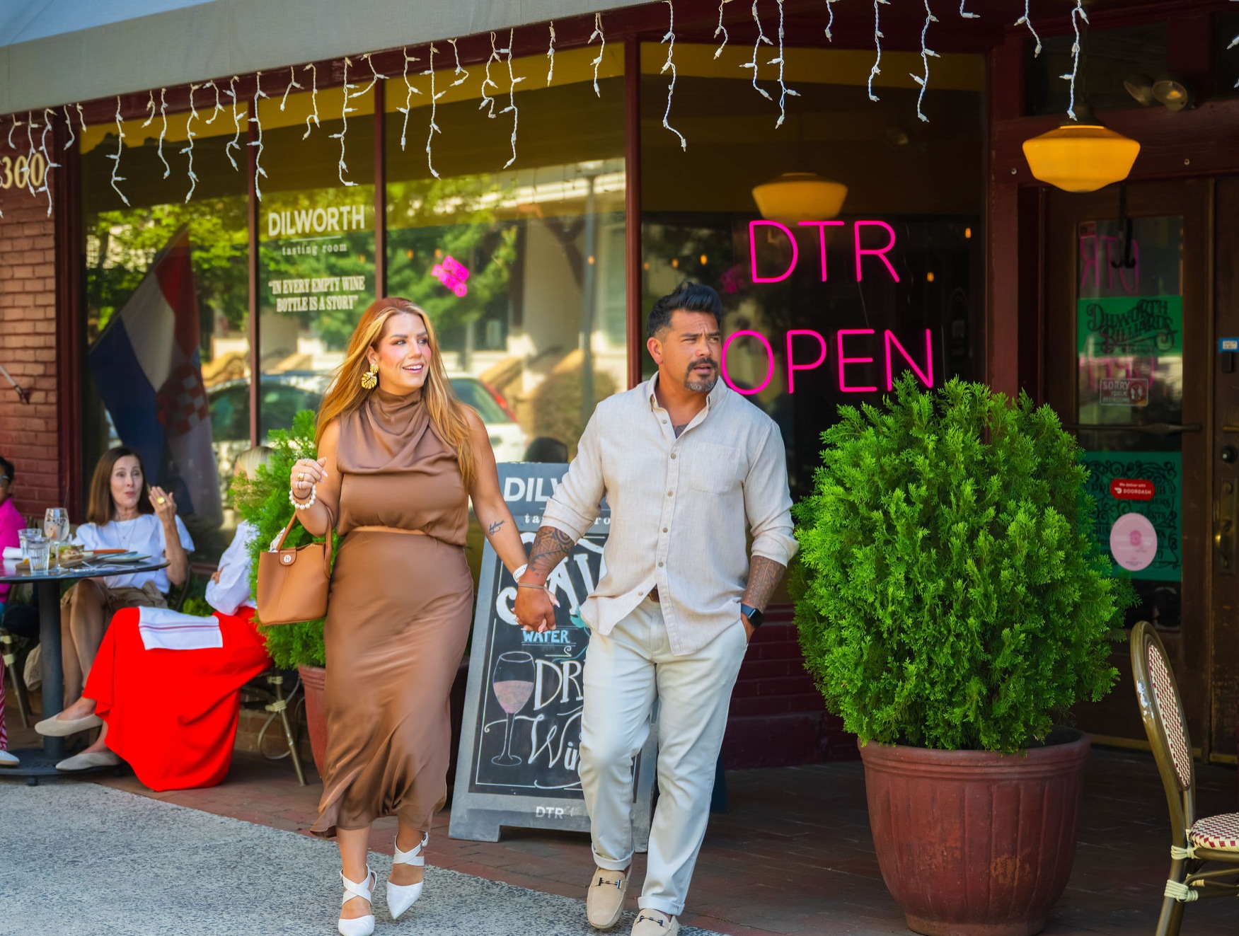DTR Resident Perks man and woman holding hands walking out of restaurant