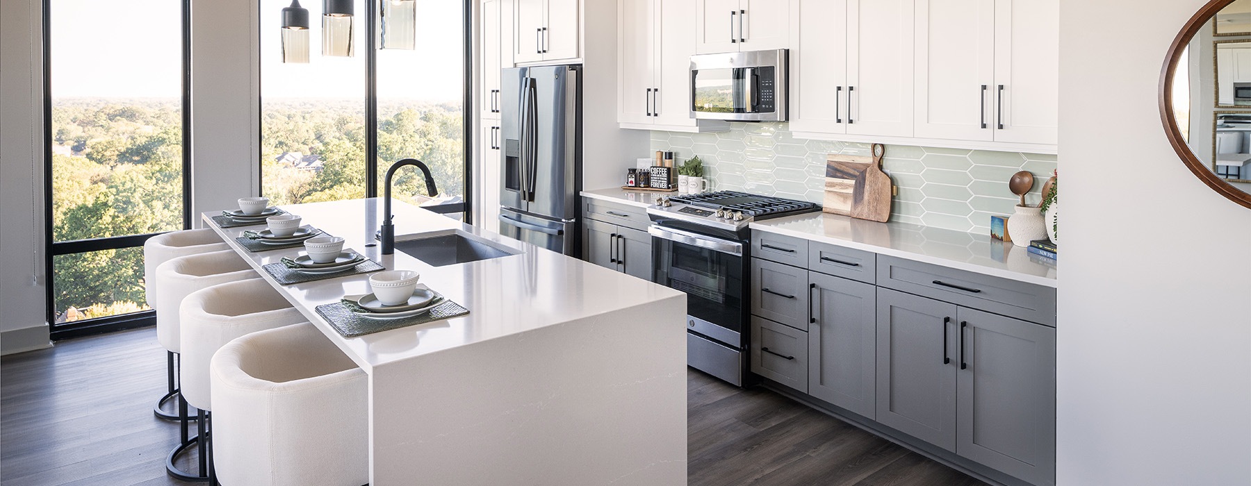 a kitchen with a bar and a table