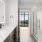 a large bathroom with mirror
