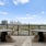 tables and chairs on rooftop terrace with city views