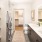 well lit bathroom with dual sink vanity