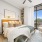 floor-to-ceiling windows in spacious bedroom