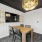 wall mounted tv with table and chairs in conference room