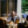 man looking at his phone at a café table