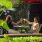 two woman toast drinks at outdoor restaurant table