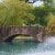 park bridge over lake with fountain