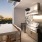 grills and eating area on rooftop balcony